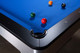 Close-up of the corner pocket on the Doc & Holliday Poshy Reverse Rainbow Slate Pool Table, featuring a genuine leather pocket, black gloss rails, and Euro Blue Championship felt. Close-up of the corner pocket on the Doc & Holliday Poshy Reverse Rainbow Slate Pool Table, featuring a genuine leather pocket, black gloss rails, and Euro Blue Championship felt.